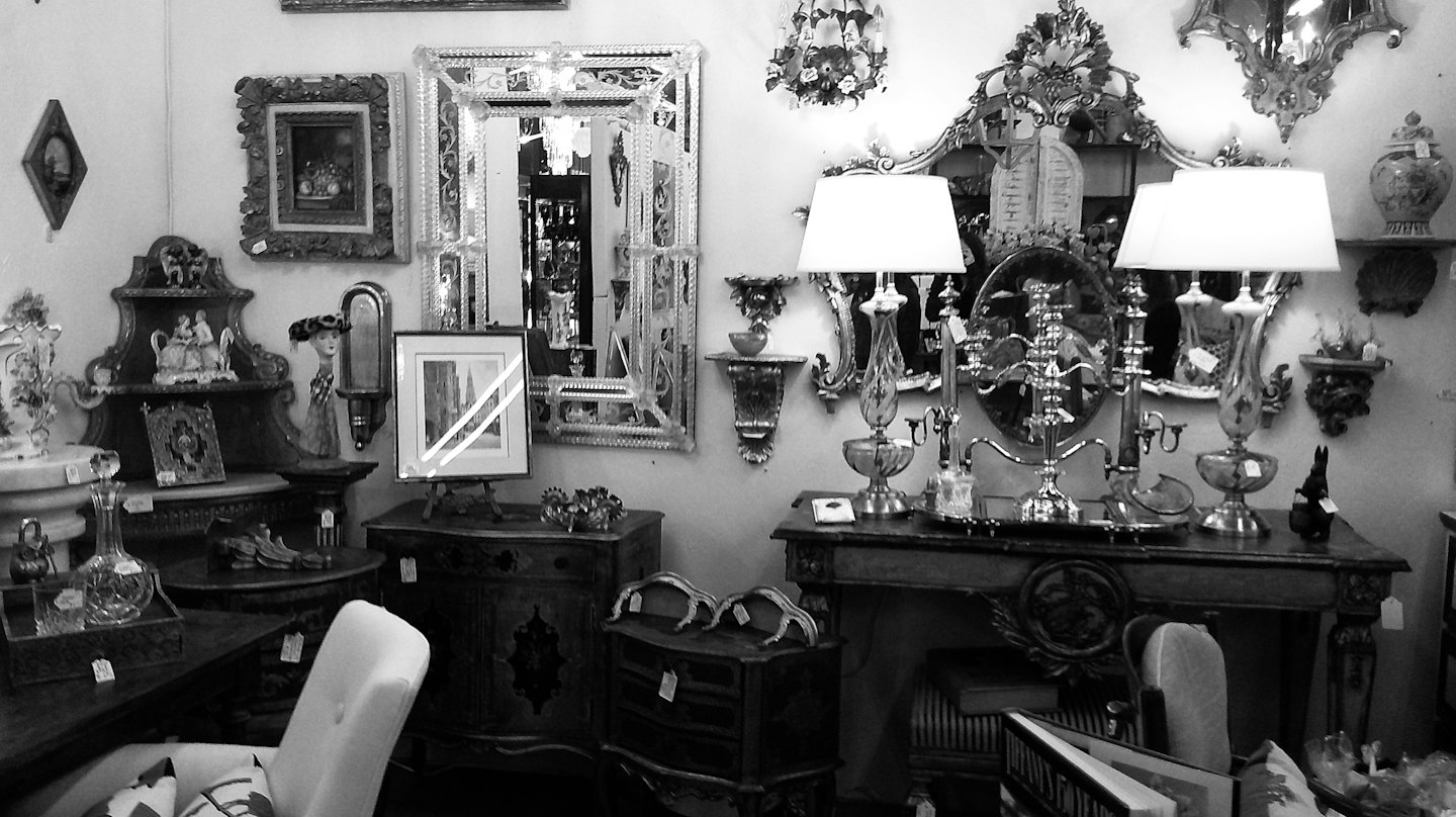 Antique shop filled with vintage furniture and decorative household items.